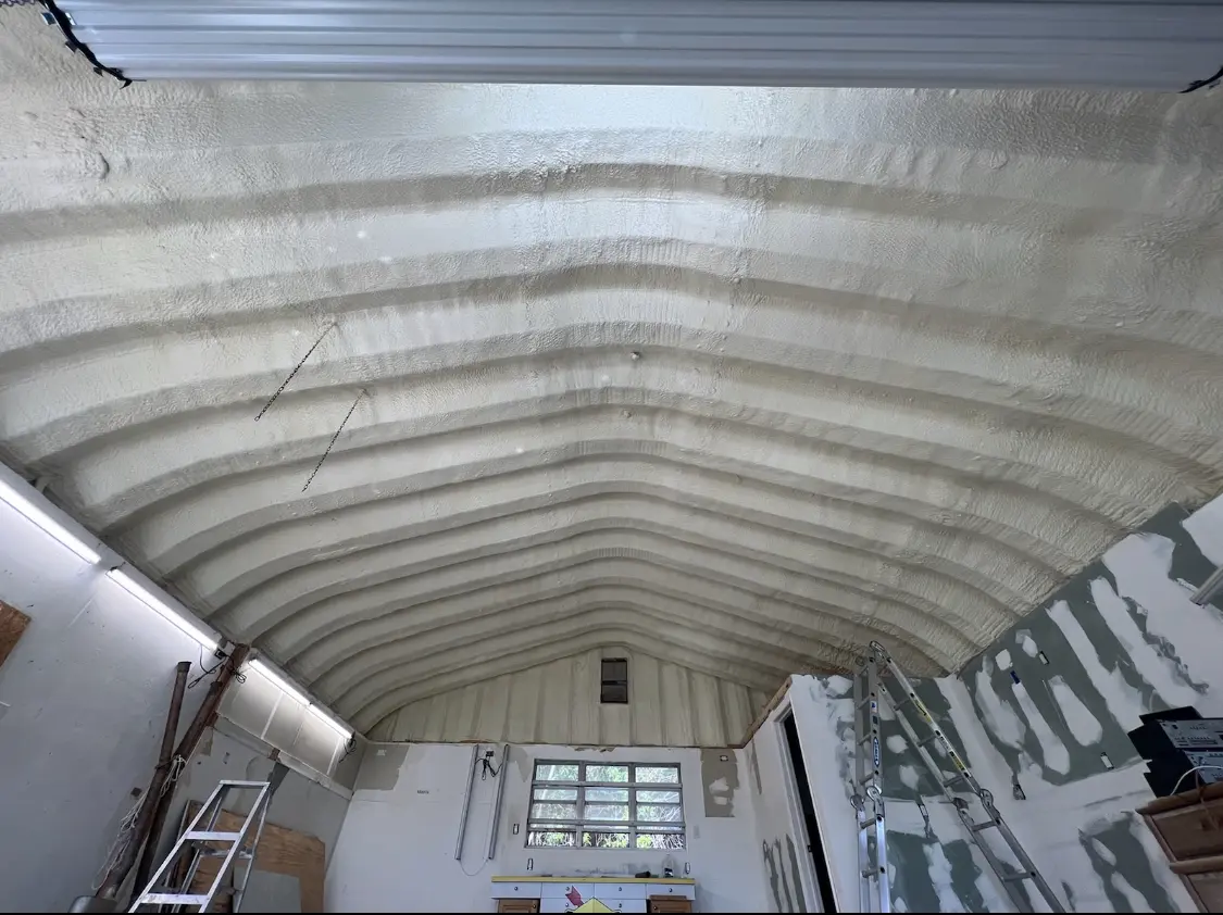Spray polyurethane foam applied to the underside of a metal roof deck in Tarboro